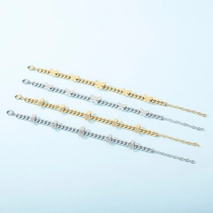 Stainless steel butterfly and pineapple charm bracelets in gold and silver finishes