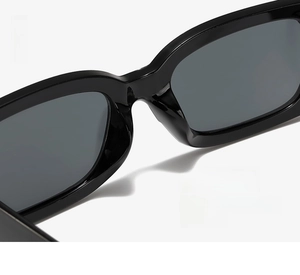 Close-up of integrated nose pad design on black square sunglasses for seamless fit