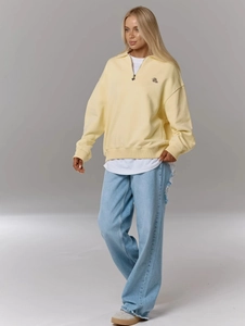 Sweat-shirt femme jaune pâle avec col polo zippé et coupe ample de style vintage