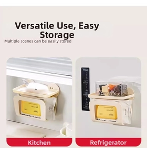Wall-mounted tissue storage box showing top shelf and bottom dispensing slot in a kitchen