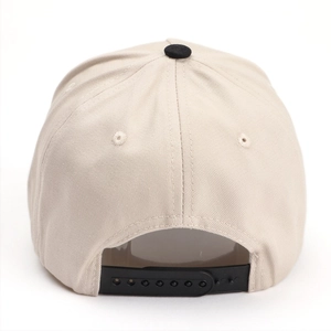 Detail view of the adjustable black snapback closure and embroidery on a beige baseball cap