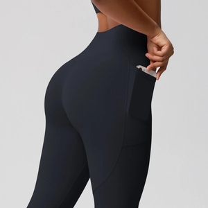Close-up of black high-waist yoga leggings featuring functional side phone pockets
