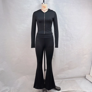 Detailed front view of women's black slim-fit zip hoodie and flared trousers set