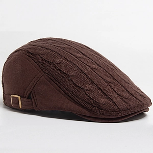 Detail of coffee brown cable knit beret cap featuring bronze metal adjustment buckle