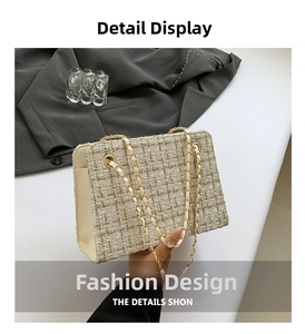 Detail of beige tweed texture and golden chain strap on a stylish crossbody bag
