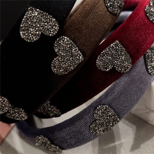 Elegant velvet padded headbands with sparkling crystal heart details in four rich colors