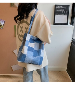 Rear view of a model wearing the blue patchwork denim tote bag with casual style