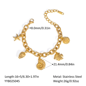 Detailed view of gold ocean charm bracelet showing starfish and shell size measurements