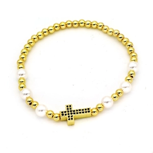 Minimalist beaded bracelet with gold metal beads, white pearls, and blue zircon cross