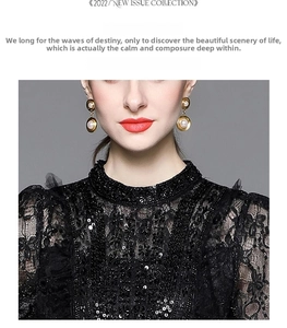 Detail of elegant black lace dress featuring intricate heavy beadwork and sequins decoration