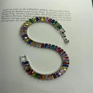 Detail of rainbow tennis bracelet with multi-color rectangular crystals and secure clasp