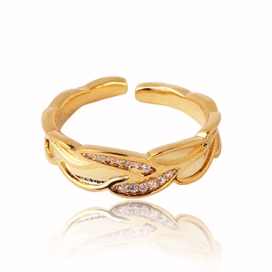 Detailed view of adjustable gold-plated leaf ring with micro-set zircon accents