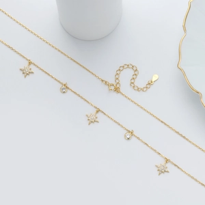 Elegant S925 sterling silver gold necklace featuring star-shaped pendants and cubic zirconia