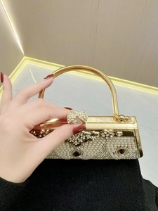 Elegant gold-tone evening bag and ring set featuring exquisite pearls and rhinestones