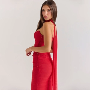 Detail of red tube top dress with halter neck tie and pleated texture fabric effect