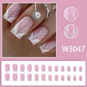 Pink press-on nails with silver glitter and white swirls, 24-piece square-shaped nail kit