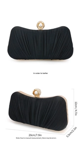 Detail view of black pleated evening bag with pearl clasp and size measurements