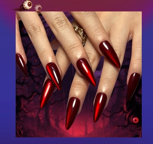 Macro detail of red and black gradient cat eye stiletto fake nails with a glossy mirror finish