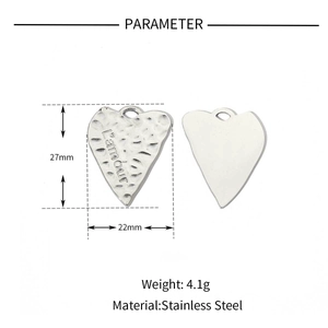 Detailed size view of heart wing pendant with hammer finish and L'amour engraving