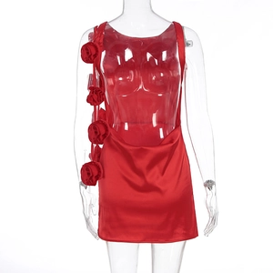 Detail of red satin mini dress featuring large 3D fabric rose floral embellishments
