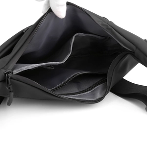 Detailed interior view of multi-compartment crossbody bag showing organized storage pockets