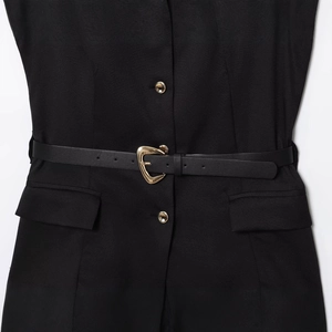 Chic sleeveless black top with gold buttons and heart-shaped buckle belt accessory