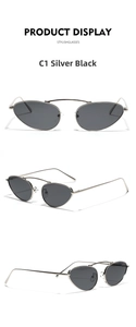 Detail of retro cat-eye sunglasses with silver metal frame and ultra-slim temples