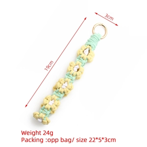Detail of handmade macrame daisy charm with dimensions 19cm length and 3cm flower width