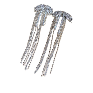 Elegant silver bow tassel earrings with sparkling rhinestones and metal finish