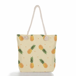Close-up of pineapple print canvas beach bag with sturdy white rope handle detail
