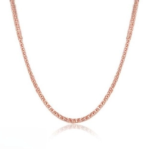 Macro view of 18k rose gold snake bone chain with intricate woven texture finish
