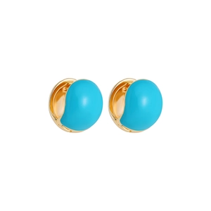 Macro shot of gold-plated hoop earrings featuring vibrant turquoise enamel inlay