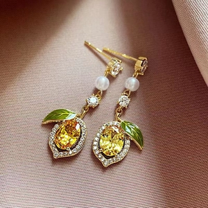 Exquisite lemon stud earrings with yellow gemstones, pearls and green enamel leaves