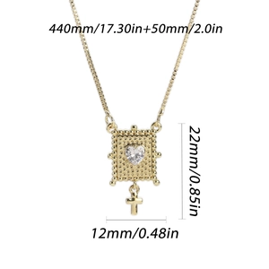 Gold heart zircon necklace with cross pendant and size specifications on white background