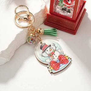 Porte-clés de Noël bonhomme de neige avec pompon vert et boule à paillettes étoilées