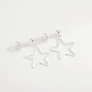 Close-up of minimalist S925 sterling silver hollow star drop earrings with spherical studs