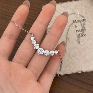 Minimalist silver smiley necklace with 7 gradient zircons on a stylish curb chain