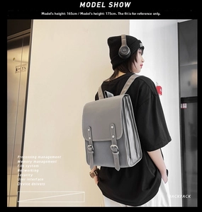 Minimalist grey faux leather backpack shown on a model for daily commute and campus use