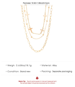 Detail shot of multilayer gold necklace with crosses, alloy material and size parameters