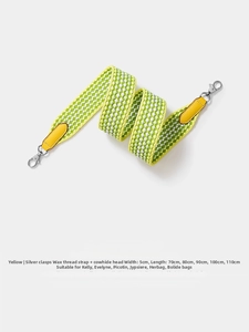 Detail of 5cm wide yellow and green woven shoulder strap with silver lobster clasp hardware