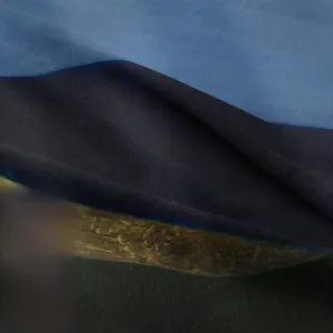 Macro shot of high-quality knitted cotton fabric texture in navy and grey-blue tones