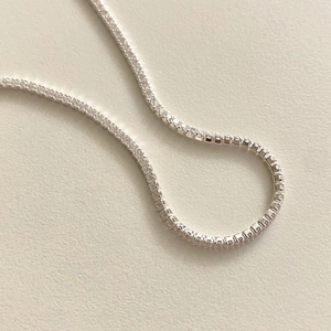 Detail of 925 sterling silver tennis bracelet with cubic zirconia in a prong setting