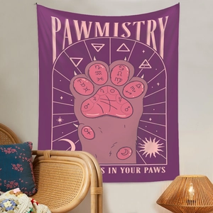 Detail of bohemian Pawmistry tapestry featuring astrological cat paw print on wall