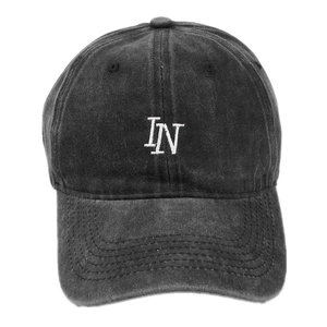 Adjustable washed cotton baseball cap in dark grey with white IN letter embroidery