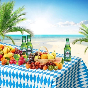 Blue and white checkered tablecloth set for Munich Oktoberfest beach party setting