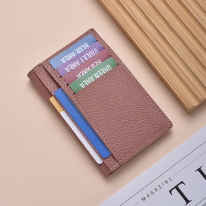 Pinkish brown litchi pattern leather card holder with multiple slots on pink background