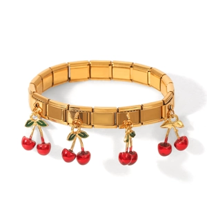 Gold stainless steel modular charm bracelet featuring vibrant red and green cherry pendants