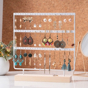 Three-tier white iron earring display stand with natural wooden base for jewelry storage
