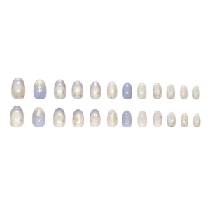 Starry sky press-on nails with glitter star and moon patterns in blue gradient