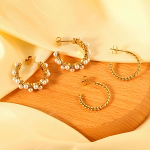 Golden C-shaped earrings set with faux pearls and twisted rope texture for women